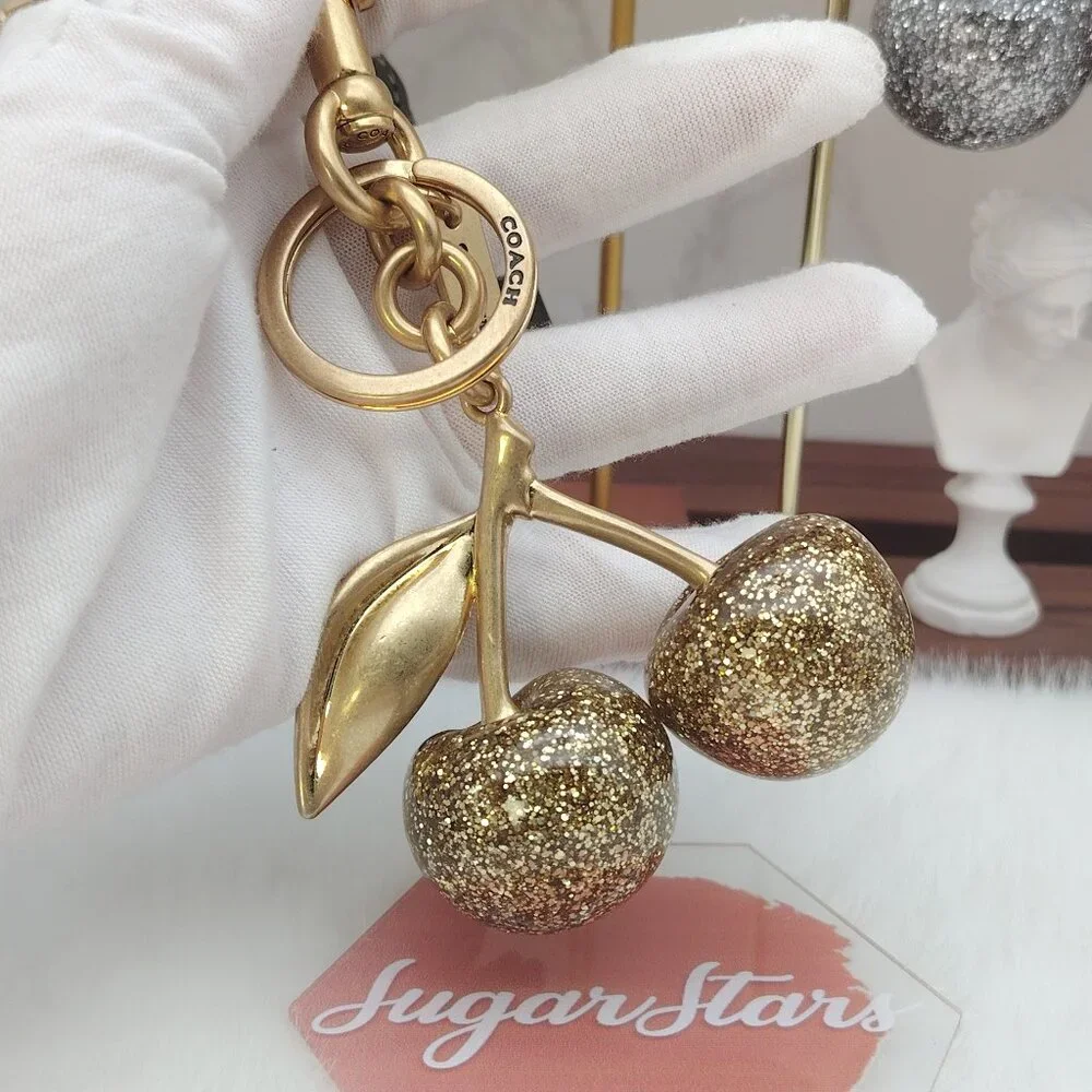 Coach cherry bag charm
